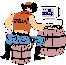 A cowboy sits on a barrel and types on a computer